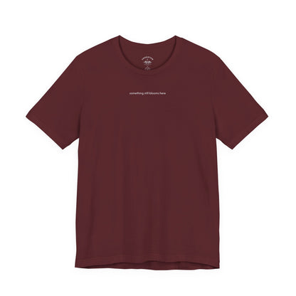 something still blooms here - whale skeleton and coral graphic t-shirt