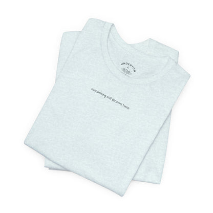 something still blooms here - whale skeleton and coral graphic t-shirt