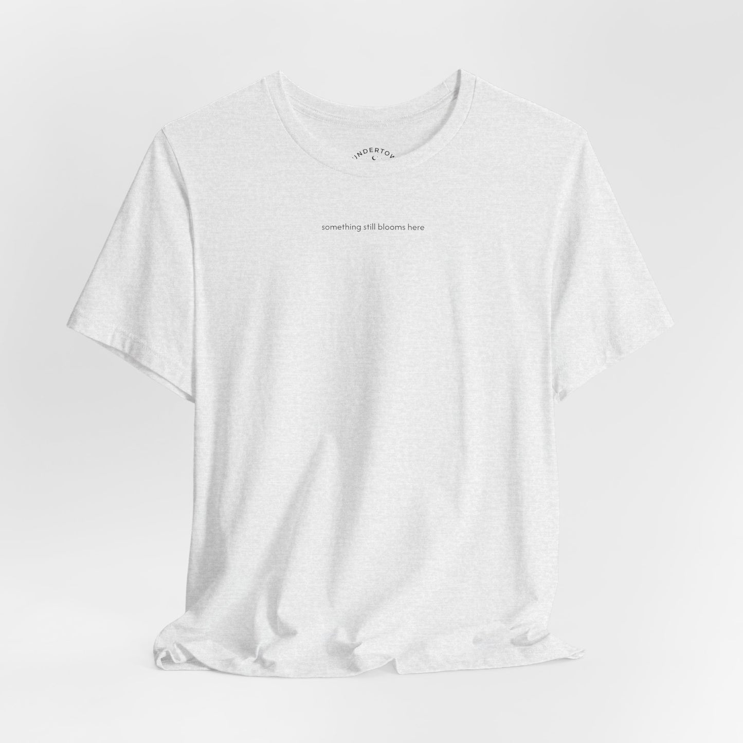 something still blooms here - whale skeleton and coral graphic t-shirt