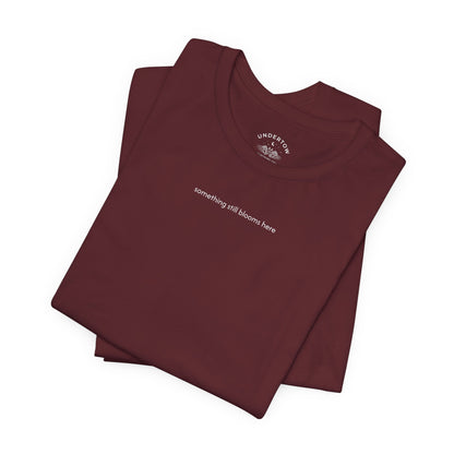 something still blooms here - whale skeleton and coral graphic t-shirt