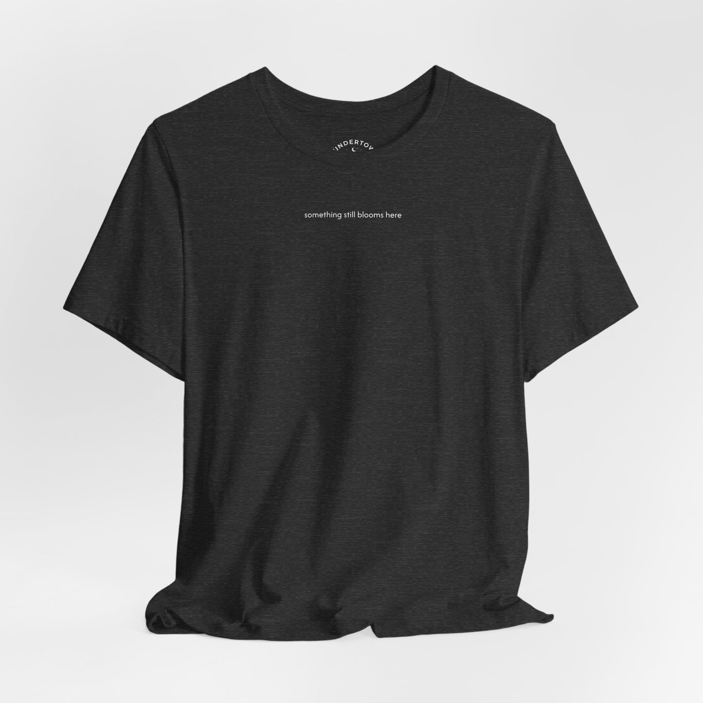 something still blooms here - whale skeleton and coral graphic t-shirt