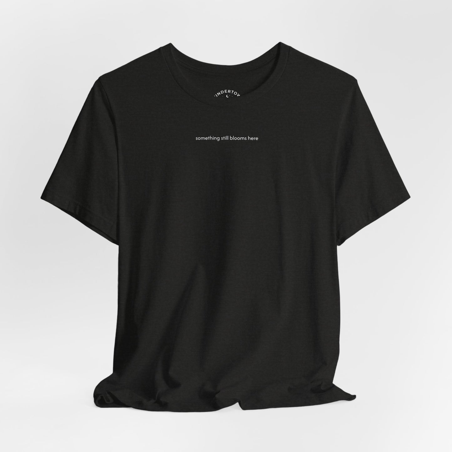 something still blooms here - whale skeleton and coral graphic t-shirt