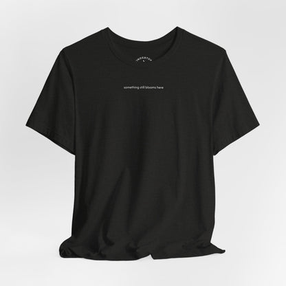 something still blooms here - whale skeleton and coral graphic t-shirt