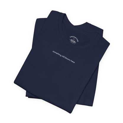 something still blooms here - whale skeleton and coral graphic t-shirt