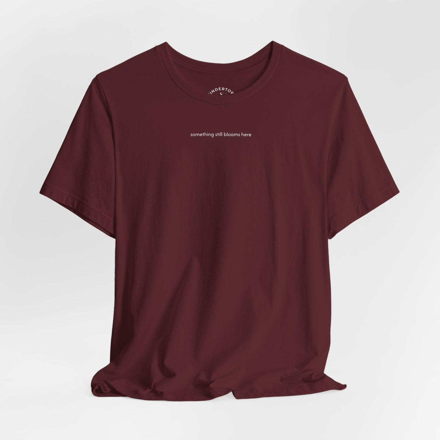 something still blooms here - whale skeleton and coral graphic t-shirt