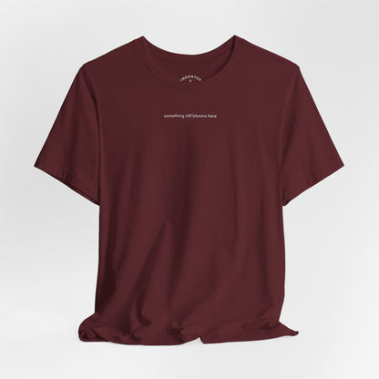 something still blooms here - whale skeleton and coral graphic t-shirt