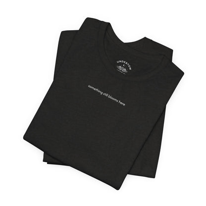 something still blooms here - whale skeleton and coral graphic t-shirt