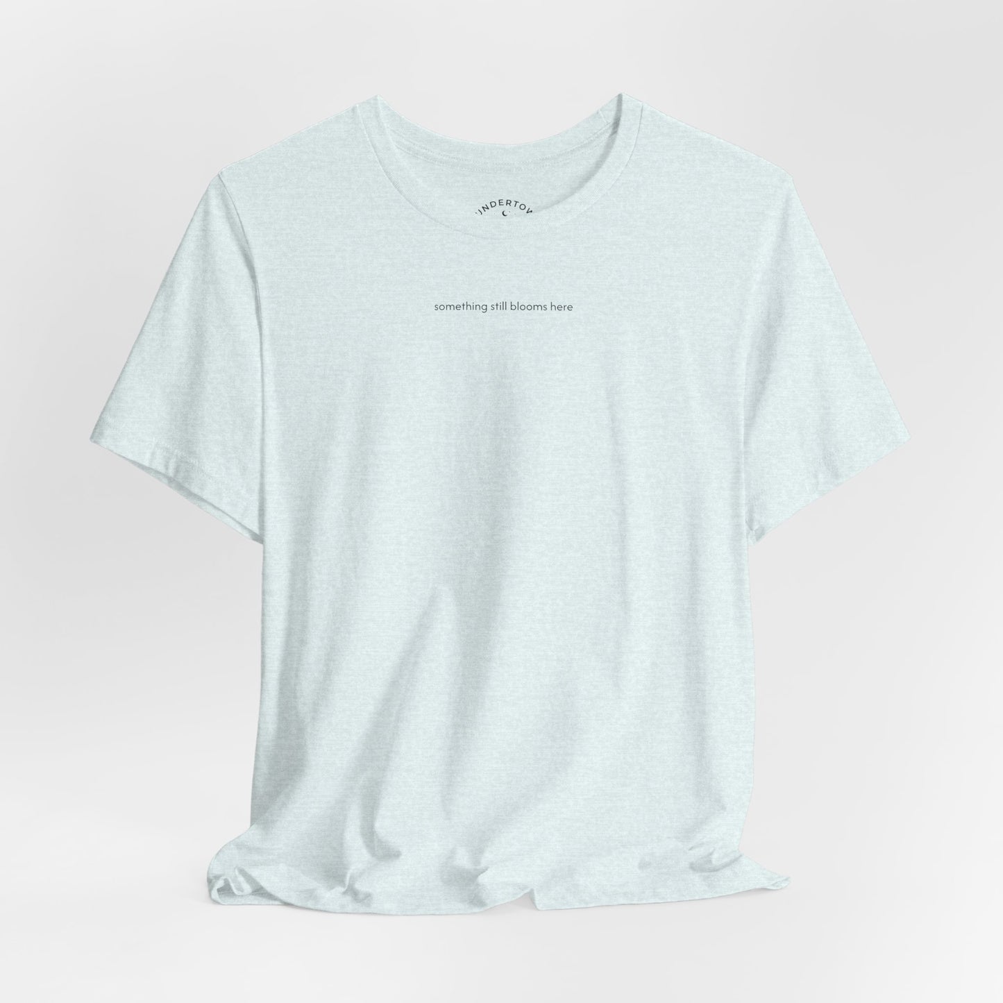 something still blooms here - whale skeleton and coral graphic t-shirt