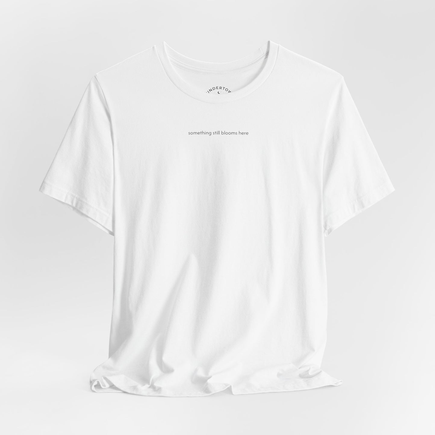 something still blooms here - whale skeleton and coral graphic t-shirt