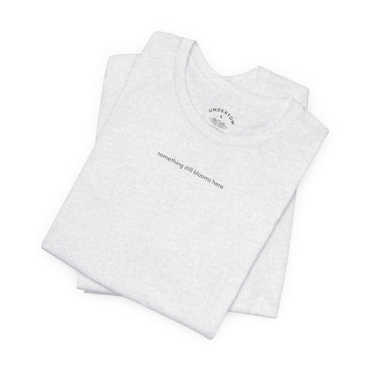 something still blooms here - whale skeleton and coral graphic t-shirt
